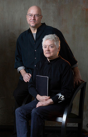 Director Ralph Lewis standing beside a seated Barbara Barclay